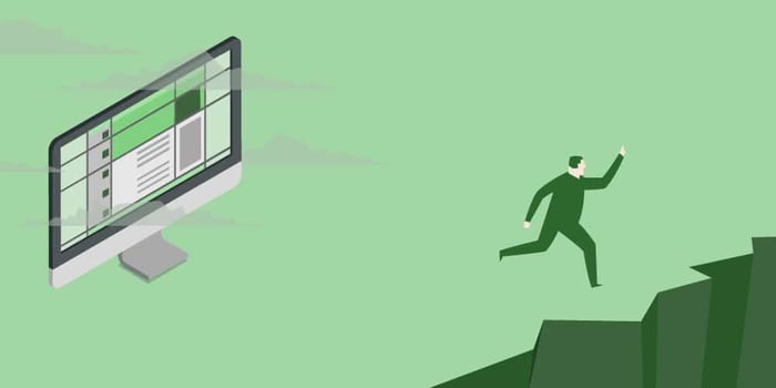 Man running away from computer monitor